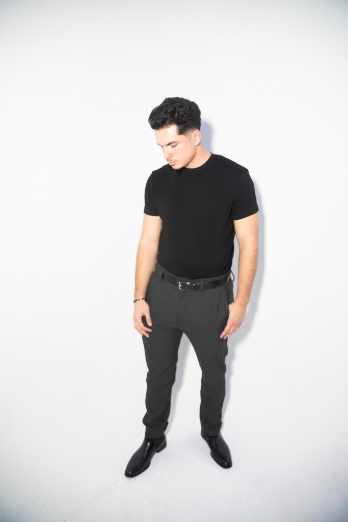 Full body image of Chris, one of master barbers at RMB Shave Parlor